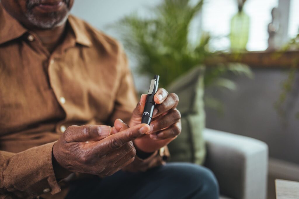 Person with diabetes checking blood sugar levels.